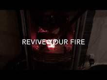 Ladda och spela upp video i Gallerivisaren, Video of a man blowing in coals and reviving a fire.