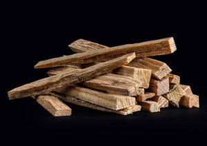 Image of a pile  fat wood  against a black background.