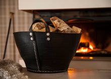 Ladda upp bild till gallerivisning, Rubber basket with steel rivets holding with wood by a fire.
